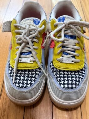Nike Kids Sneakers in Yellow, Black & White with Blue and Red Accents